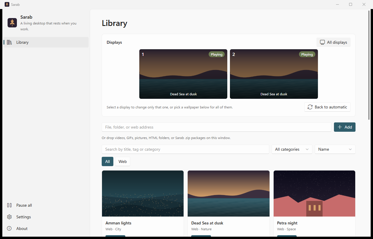 The Sarab window: two displays playing Dead Sea at dusk, and a library of wallpapers with thumbnails